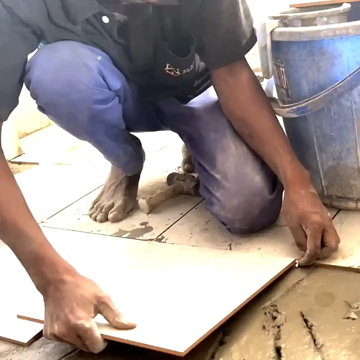 Stone & Tiles Repair Services in Bangalore stones replacement Clean Fanatics technician working on tile replacement.