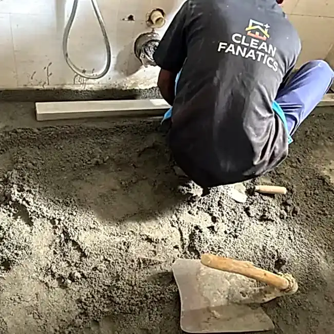 Stone & Tiles Repair Services in Bangalore stones replacement Clean Fanatics technician preparing surface for tile replacement