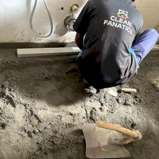 Clean Fanatics - Book Professional Cleaning Services Bangalore Professional Cleaning Services Clean Fanatics technician preparing floor for tile replacement.
